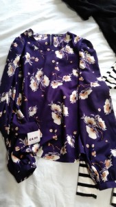 Purple satin long sleeved top with floral design